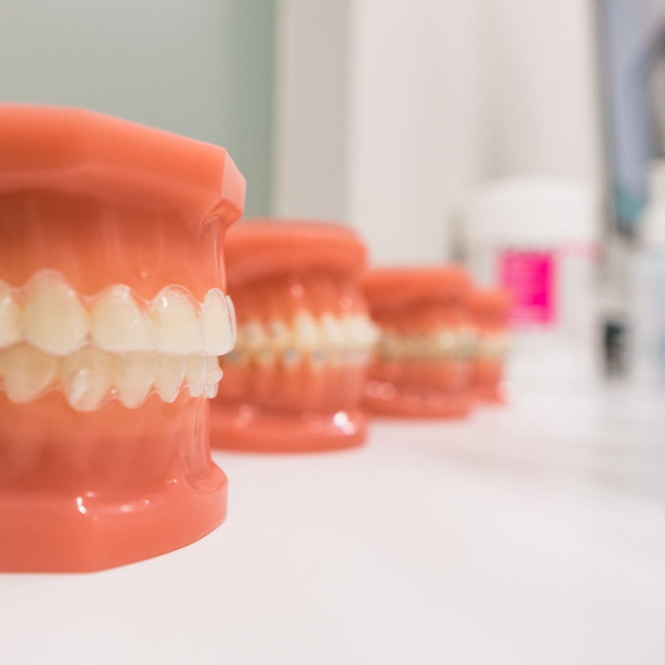 DSCF0347 Models of teeth with clear aligners displayed, illustrating orthodontic treatment options at Paradigm Orthodontics.